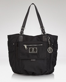 Glamor-girl brand Juicy Couture takes a practical approach to accessorizing with this nylon tote bag. Ideally sized for days on the go, it perfects easy-chic style. Glamor-girl brand Juicy Couture takes a practical approach to accessorizing with this nylon tote bag. Ideally sized for days on the go, it perfects easy-chic style.