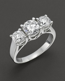 Triple diamond stone ring set in white gold. Triple diamond stone ring set in white gold.