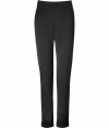 With their dressy sheen and flattering high waist, these sleek stretch trousers from Donna Karan are a contemporary luxe staple tailored to all-season sophistication - Hidden side zip, stitched cuffs, cut-out detail at back - Slim fit - Wear with modern knits and ankle boots, or dress up with feminine silk tops and chic statement heels