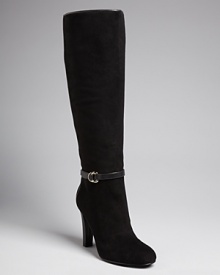 IVANKA TRUMP adds fine detail in the form of delicate buckled harness belts to stately suede tall boots.