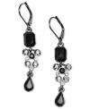 Dress up your everyday look or add a splash of dramatic contrast to your evening wear with these beautiful Givenchy drop earrings. With octagonal and teardrop cut jet crystals and a cluster of round-cut clear and jet stones. Each measures 2 inches long.