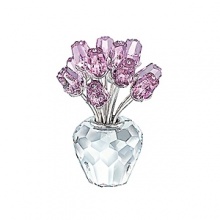 The vase and the 12 rosebuds in faceted crystal; Clear crystal stones in the middle of each bud; Rosaline colored roses. Stems rhodium plated. The vase and the 12 rosebuds in faceted crystal; Clear crystal stones in the middle of each bud; Rosaline colored roses. Stems rhodium plated.