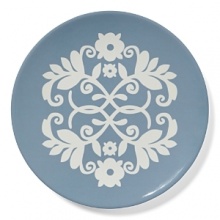 A decorative pattern adorns this versatile salad plate, perfect for a medley of greens or a selection of juicy fruits.