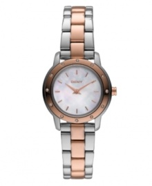 Mix it up with the contrasting metals of this mini. Watch by DKNY crafted of stainless steel bracelet with rose-gold tone center links and round case. Rose-gold tone bezel embellished with crystal accents. White mother-of-pearl dial features rose-gold tone stick indices, two hands and logo. Quartz movement. Water resistant to 30 meters. Two-year limited warranty.