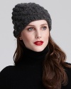 Bring on-trend texture to your winter looks with this popcorn knit beanie from Michael Kors.