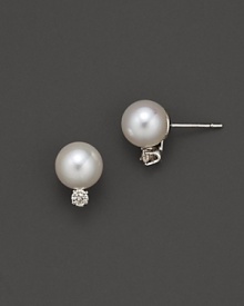 Diamonds add sparkle to shimmering pearl studs set in white gold. Diamonds add sparkle to shimmering pearl studs set in white gold.