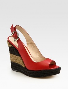 Two-tone espadrille wedge with a smooth leather upper, peep toe and an adjustable slingback strap. Hemp wedge, 5 (125mm)Hemp platform, 1 (25mm)Compares to a 4 heel (100mm)Leather upperLeather lining and solePadded insoleMade in SpainOUR FIT MODEL RECOMMENDS ordering one half size up as this style runs small. 