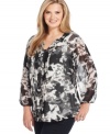 Refresh your style for the season with Calvin Klein's plus size peasant blouse, finished by a pleated front.