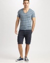 Contrasting stripes and an unfinished hem add some cool style to this comfortable v-neck design. V-neckShort sleevesUnfinished hemlineAbout 28 from shoulder to hem60% polyester/25% cotton/15% linenMachine washImported