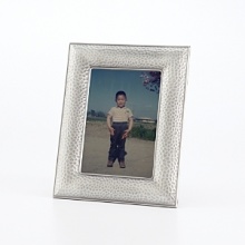 Elegantly display your favorite photos with this pebble-embossed Prinz metal frame in a radiant silver-tone hue. Elegantly display your favorite photos with this pebble-embossed Prinz metal frame in a radiant silver-tone hue.