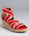 Boldly bright, Tory Burch Bridee espadrilles feature a moderate heel height perfect for all-day adventures.