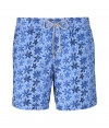 A brand original style since the 70s detailed with a small tropical floral print, Vilebrequins Moorea swim trunks are as fun as they are iconic - Waterproof elastic waistband, back flap pocket, side slit pockets, back eyelets for release of water, durable drawstring cord with stainless metal aglets, interior cotton briefs - Classic slim fit - Wear in the water, or post-swim with a polo and flip-flops - Comes with a logo printed drawstring pouch