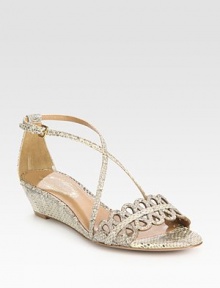 Snake-print leather wedge with adjustable, ultra-skinny straps and a feminine, laser-cut front strap. Self-covered wedge, 1½ (40mm)Snake-print leather upperLeather lining and solePadded insoleImportedOUR FIT MODEL RECOMMENDS ordering one half size up as this style runs small. Snake-print leather wedge with adjustable, ultra-skinny straps and a feminine, laser-cut front strap. Self-covered wedge, 1½ (40mm)Snake-print leather upperLeather lining and solePadded insoleImportedOUR FIT MODEL RECOMMENDS ordering one half size up as this style runs small.