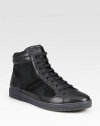 Be one step ahead of the style game in these high-top sneakers featuring a smooth leather upper with a haircalf panel design and lace-up front.Leather/haircalf upperLeather liningPadded insoleRubber soleMade in Italy