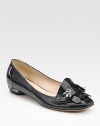 Sharp and sophisticated patent leather design, accented with a silver-edged heel, gunmetal studs and matching tassels.Self-covered heel, ¼ (5mm) Leather lining and sole Made in ItalyOUR FIT MODEL RECOMMENDS ordering one size up as this style runs small. 