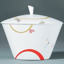 For over two centuries Raynaud has created unique Limoges porcelain, with a marked preference for relief shapes and generously colored and gilt decorations. Metamorphoses is a striking pattern of red and gold with a butterfly motif.