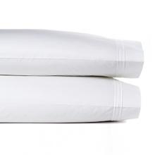 Triple bands of embroidered piping add a sophisticated tailored note to this sleek pillowcase. Triple bands of embroidered piping add a sophisticated tailored note to this sleek pillowcase.