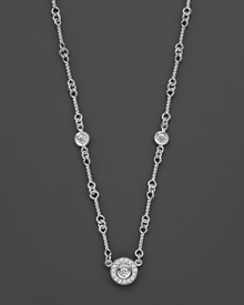 A white gold necklace has double-sided diamond stations; with signature ruby accent. Designed by Roberto Coin. A white gold necklace has double-sided diamond stations; with signature ruby accent. Designed by Roberto Coin.