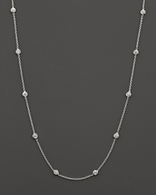 A diamond station necklace with signature ruby accent. Designed by Roberto Coin. A diamond station necklace with signature ruby accent. Designed by Roberto Coin.