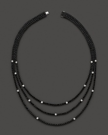 Faceted black sapphires, punctuated by diamonds, form three dazzling strands. By Roberto Coin. Faceted black sapphires, punctuated by diamonds, form three dazzling strands. By Roberto Coin.