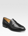 EXCLUSIVELY OURS. Ultimate style and comfort, crafted in Italy with classic penny loafer details in smooth leather. Leather lining Padded insole Leather sole Made in Italy 