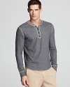 A seamed hem with contrast thread gives this soft henley an unexpected designer edge.