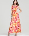 Garden party glam -- a dramatic low scoop back and floor-sweeping maxi length give this rose print Alice + Olivia dress high-style appeal.