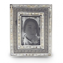 Handmade in sand-cast aluminum with a trademark blend of enamel infused with crushed mother of pearl, Julia Knight's classic picture frame features beautiful mosaic borders made of handcut Mother of Pearl tiles. Black velvet trims the back for an elegant look. Handmade in sand-cast aluminum with a trademark blend of enamel infused with crushed mother of pearl, Julia Knight's classic picture frame features beautiful mosaic borders made of handcut Mother of Pearl tiles. Black velvet trims the back for an elegant look.