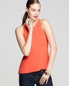 Turn around in this pop-bright BCBGMAXAZRIA tank to reveal an elongated back hem, accented with a skin-revealing vent.