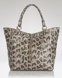 Cole Haan's most practical style is dressed up in python-embossed leather and woven details. Ample pockets and a roomy interior make this style ideal for the busy (but stylish) woman. Cole Haan's most practical style is dressed up in python-embossed leather and woven details. Ample pockets and a roomy interior make this style ideal for the busy (but stylish) woman.