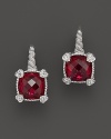 Brilliant red corundum is framed with four petite hearts on these cushion stone earrings from Judith Ripka.