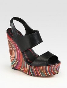 Smooth leather slingback design elevated by a vibrant, '70s-inspired wedge and platform. Self-covered wedge, 6 (150mm)Covered platform, 2 (50mm)Compares to a 4 heel (100mm)Leather upperLeather liningBuffed leather solePadded insoleImportedOUR FIT MODEL RECOMMENDS ordering one half size up as this style runs small. 