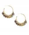 On the move. Kenneth Cole New York's shaky hoop earrings add a stylish sense of motion to your look. Crafted in gold tone, bronze tone and silver tone mixed metal, they're adorned with chic beads. Approximate diameter: 1-1/2 inches.