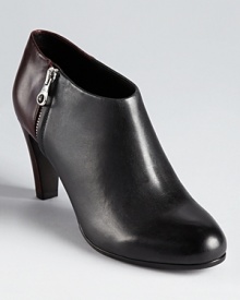 See by Chloé's streamlined two-tone booties showcase a color block construction in subtle, understated hues. See by Chloé's streamlined two-tone booties showcase a color block construction in subtle, understated hues.