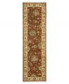 Bring new life to any room of your home. This gorgeous rug, sprouting intricate designs of vinery and blossoming flowers, opens up any space with warm tones of burnt red and beige. With an all-wool construction, accented with rich silk highlights, this stylish Nourison 2000 import is ultra-durable and luxuriously soft to the touch.