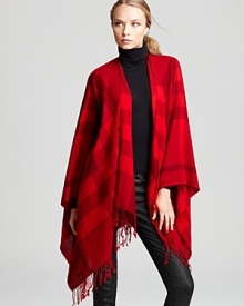 Bold red hues in an oversized Burberry check keep you warm and stylish. Bold red hues in an oversized Burberry check keep you warm and stylish.