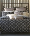 Undeniably modern, the Bryan Keith Portland reversible comforter set offers two sophisticated patterns for a multitude of mix and match possibilities. One side of the comforter and shams feature bold stripes while the other boasts interlocking rings. Ribbed European shams and striking decorative pillows finish the look in style. (Clearance)