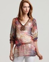 An outrageously pretty print combines with luxe beading to dress up the Shiloh770 tunic.