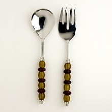 This stylish serving set combines amber and ruby glass handles with exquisitely hand-polished metal. This stylish serving set combines amber and ruby glass handles with exquisitely hand-polished metal.