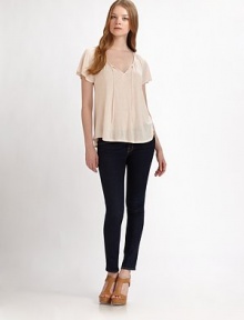 A sweet and airy design with delicate embroidery and subtle feminine detailing. Open v-neck with self tie and embroidered trimDropped shouldersShort cap sleevesViscoseMachine washImportedModel shown is 5'10 (177cm) wearing US size Small. A sweet and airy design with delicate embroidery and subtle feminine detailing. Open v-neck with self tie and embroidered trimDropped shouldersShort cap sleevesViscoseMachine washImportedModel shown is 5'10 (177cm) wearing US size Small.