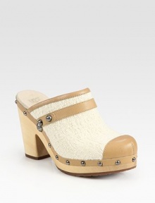 Studded leather classic with a wooden heel, rejuvenated by a contrasting woven wool yarn upper and rubber sole for traction. Wooden heel, 4 (100mm)Wooden platform, 1 (25mm)Compares to a 3 heel (75mm)Leather and woven wool yarn upperLeather liningRubber solePadded insoleImported Studded leather classic with a wooden heel, rejuvenated by a contrasting woven wool yarn upper and rubber sole for traction. Wooden heel, 4 (100mm)Wooden platform, 1 (25mm)Compares to a 3 heel (75mm)Leather and woven wool yarn upperLeather liningRubber solePadded insoleImported