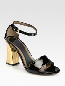 A sculpted goldtone heel characterizes this daring patent leather silhouette. Goldtone heel, 2 (50mm)Patent leather upperAdjustable ankle strapLeather lining and solePadded insoleMade in Italy A sculpted goldtone heel characterizes this daring patent leather silhouette. Goldtone heel, 2 (50mm)Patent leather upperAdjustable ankle strapLeather lining and solePadded insoleMade in Italy
