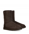 A true original and casually stylish go-to from UGG Australia, the classic chocolate short boot is a perennial must - Crafted from twin-faced sheepskin and featuring exposed seams, reinforced heel, traction outsole and signature UGG label - Fleece-lined for superior warmth and comfort - Shorter, mid-calf height ideal for wearing under or over pants - Truly versatile, perfect for pairing with everything from skinny jeans to yoga pants to mini-skirts