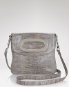 In shiny glossy glazed lizard, MICHAEL Michael Kors' crossbody bag is a city girl's go-to.