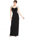 JS Boutique's evening gown dazzles with jeweled cap sleeves and a striking floor-length look.