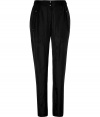 Stylish pant in fine, pure black silk - A chic twist on a classic from eco-friendly label Edun - Soft, lightweight fabric has a subtle sheen - Slimmer through legs, roomier through waist and thighs - Higher rise, with elasticated ruched waist and snap closure - Two oversize pockets with grommet detail at hips - Flattering flap pockets at rear - Polished and versatile, ideal for both work and play - Pair with a silk blouse or a t-shirt and blazer and pumps or ankle booties