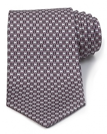 A luxurious piece that lies at the center of your dress wardrobe, this handsome tie from Salvatore Ferragamo is crafted in 100% Italian silk. A luxurious piece that lies at the center of your dress wardrobe, this handsome tie from Salvatore Ferragamo is crafted in 100% Italian silk.