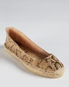 Python embossed leather dresses up a flat espadrille silhouette from Andre Assous.