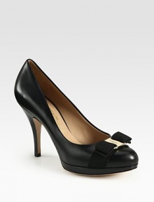 A logo-detailed grosgrain bow adorns this classic platform silhouette in fine Italian leather and glossy patent. Painted stacked heel, 4 (100mm)Patent leather platform, ½ (15mm)Compares to a 3½ heel (90mm)Leather upper with grosgrain trimLeather lining and solePadded insoleMade in Italy A logo-detailed grosgrain bow adorns this classic platform silhouette in fine Italian leather and glossy patent. Painted stacked heel, 4 (100mm)Patent leather platform, ½ (15mm)Compares to a 3½ heel (90mm)Leather upper with grosgrain trimLeather lining and solePadded insoleMade in Italy