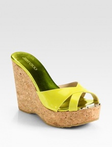 Bands of glossy patent leather interlace atop this cork wedge, finished with reflective metallic leather and metal accents. Cork wedge, 4½ (115mm)Cork platform, 1½ (40mm)Compares to a 3 heel (75mm)Patent leather upperMetallic leather lining with metal insert detailRubber solePadded insoleMade in Spain Bands of glossy patent leather interlace atop this cork wedge, finished with reflective metallic leather and metal accents. Cork wedge, 4½ (115mm)Cork platform, 1½ (40mm)Compares to a 3 heel (75mm)Patent leather upperMetallic leather lining with metal insert detailRubber solePadded insoleMade in Spain